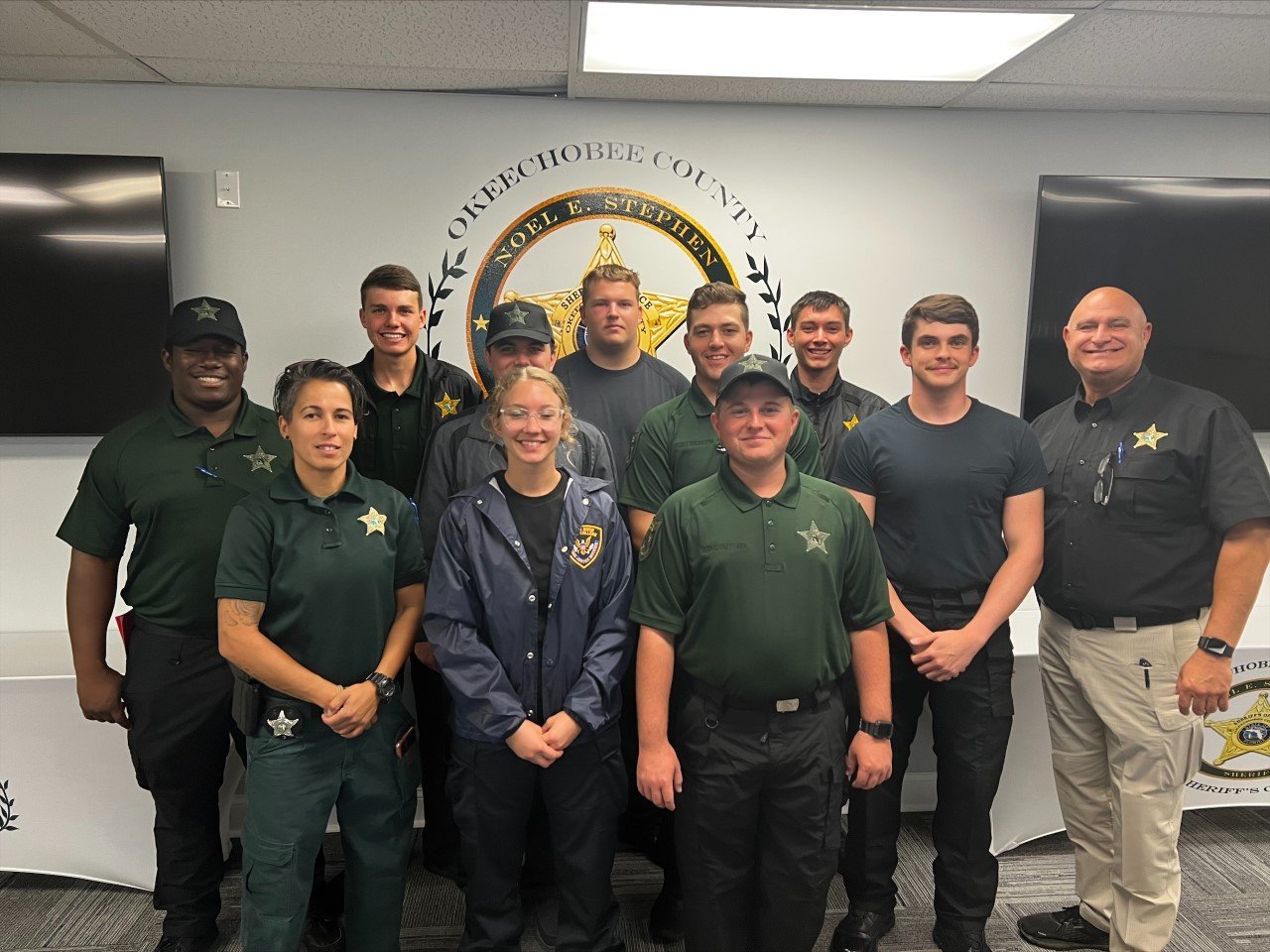 Do you remember our L.E.A.P. initiative (Law Enforcement Apprenticeship Program) for recent Okeechobee High School graduates and interested persons for corrections certification?

Here they are, our first official corrections academy participants.

Today the class came through and visited our H.Q. and saw where they could potentially work in a few months.

Pictured with them are Detention Training Coordinator Dory Sanchez and Chief Deputy Major Michael Hazellief.